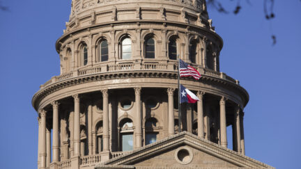 Capitol Building in Austin, Texas, showing American and Texan flags