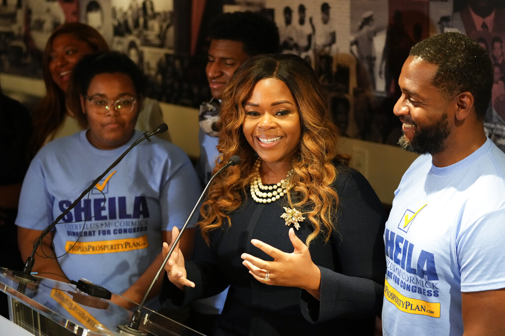 Democrat Sheila Cherfilus-McCormick, second right, is flanked by her husband Corlie McCormick, right, and her two children, as she speaks to the press and supporters at an election night party following a special election, Tuesday, Jan. 11, 2022, in Fort Lauderdale, Fla. Cherfilus-McCormick, a health care company CEO, defeated Republican Jason Mariner in the special election to fill Florida's 20th Congressional District seat, left vacant after Democratic U.S. Rep. Alcee Hastings died last April of pancreatic cancer.