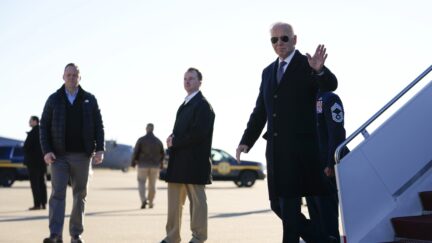 President Joe Biden waves as he arrives on Air Force One at Delaware Air National Guard Base in New Castle, Del., Sunday, Jan. 15, 2023.