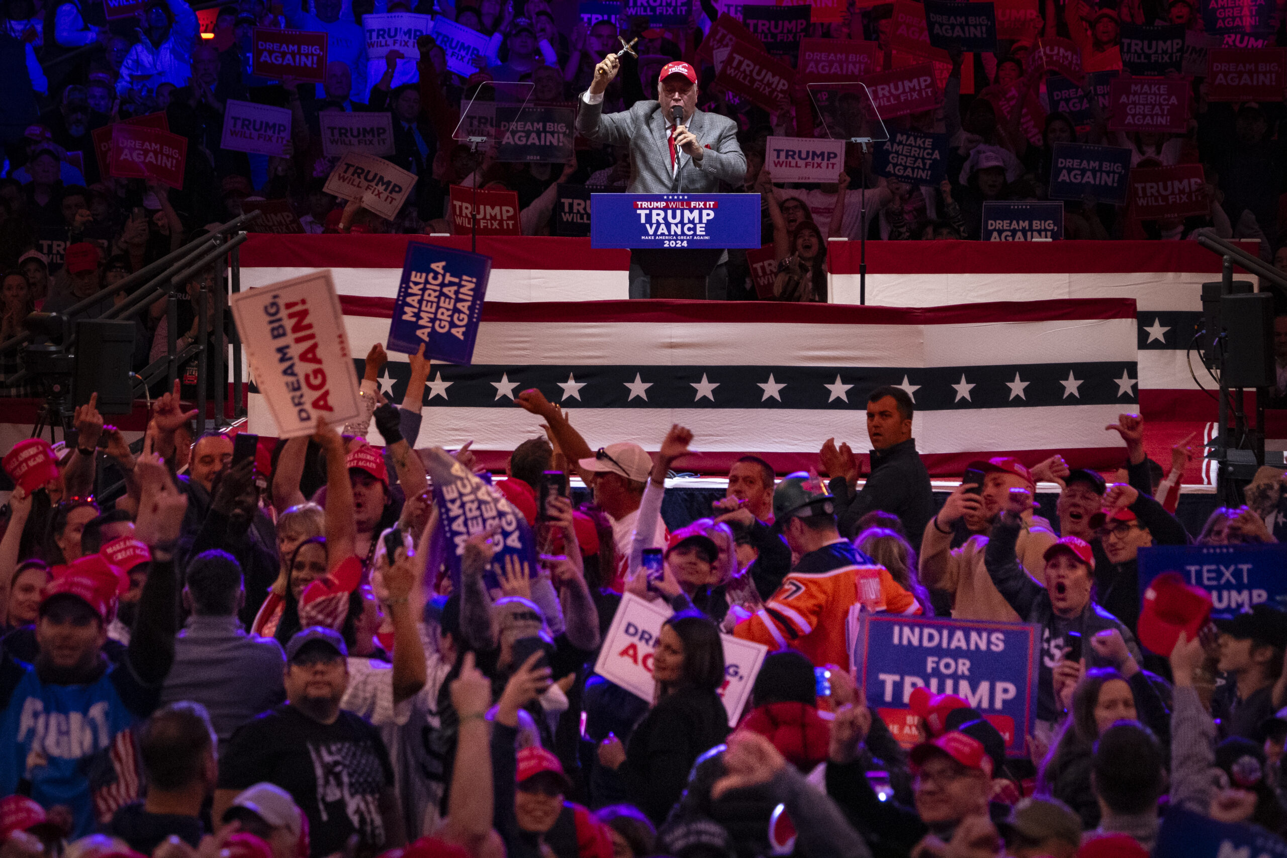 David Rem, a childhood friend of former President Trump, waves his cross and shames the media.