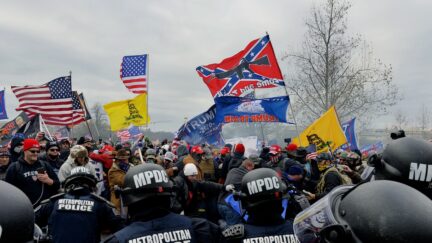 Trump supporters clash with police and security forces as they storm the US Capitol in Washington D.C on January 6, 2021. - Demonstrators breeched security and entered the Capitol as Congress debated the a 2020 presidential election Electoral Vote Certification. (Photo by Joseph Prezioso / AFP) (Photo by JOSEPH PREZIOSO/AFP via Getty Images)