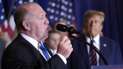 Tom Homan speaks as Republican presidential candidate former President Donald Trump listens at a primary election night party in Nashua NH Tuesday January 23 2024